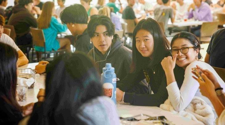 Students pose for a group photo in McConnell Bistro