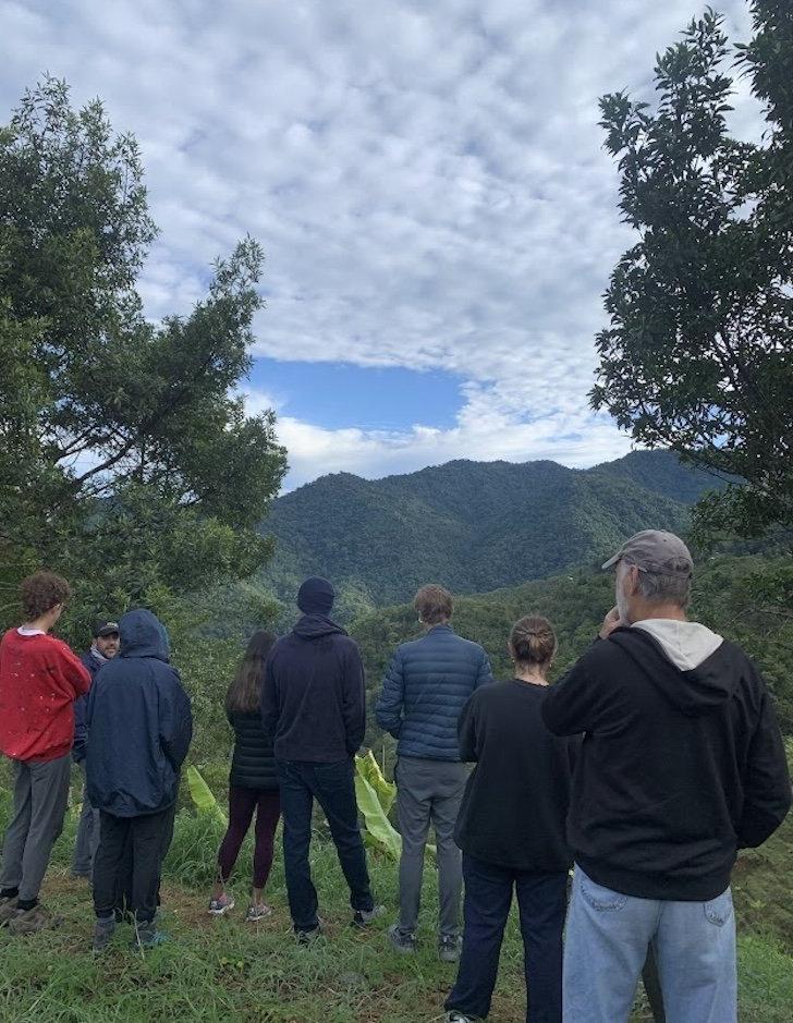 Group looking toward mountains with blue sky