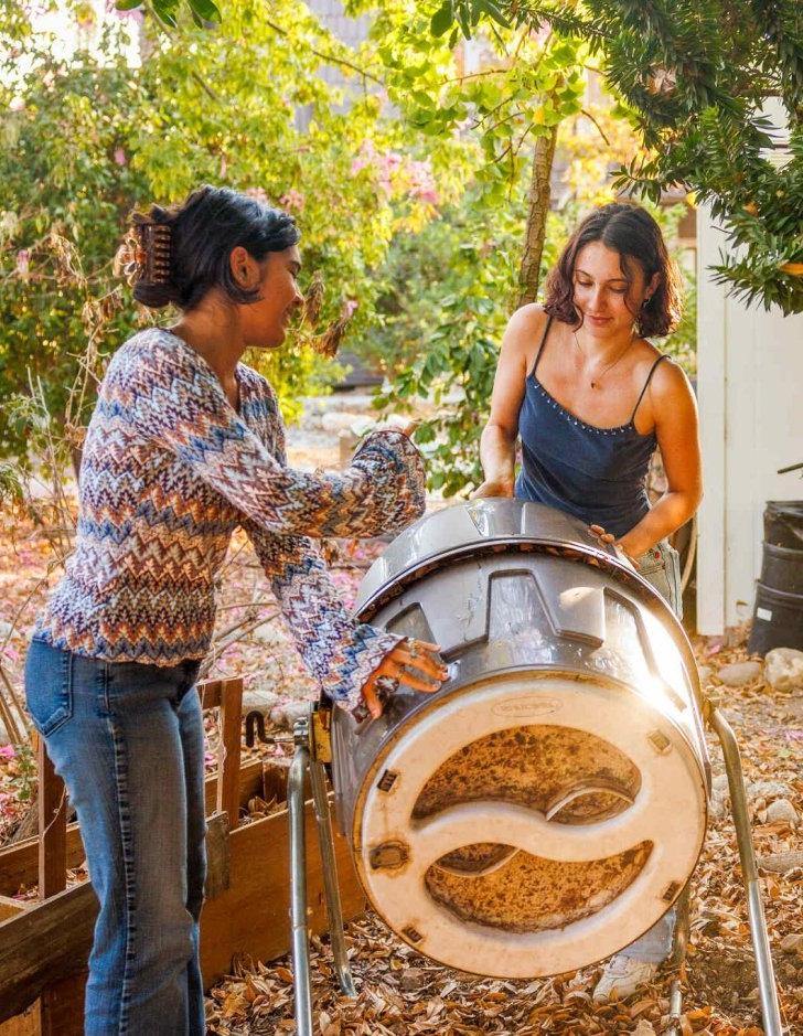 Stdudents rotate the student garden compost